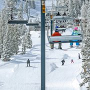 Chair Lift with Boarders and Skiers Below